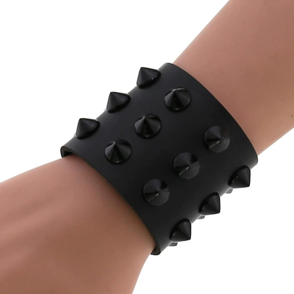 Wide vegan leather spike bracelet for men and women, featuring adjustable rivets for a stylish fit.