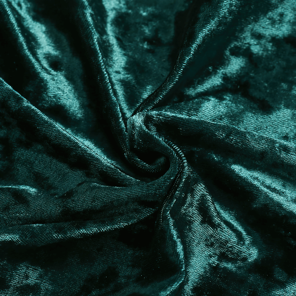 Close-up of plush teal velvet fabric with a luxurious sheen and soft texture, perfect for elegant clothing.