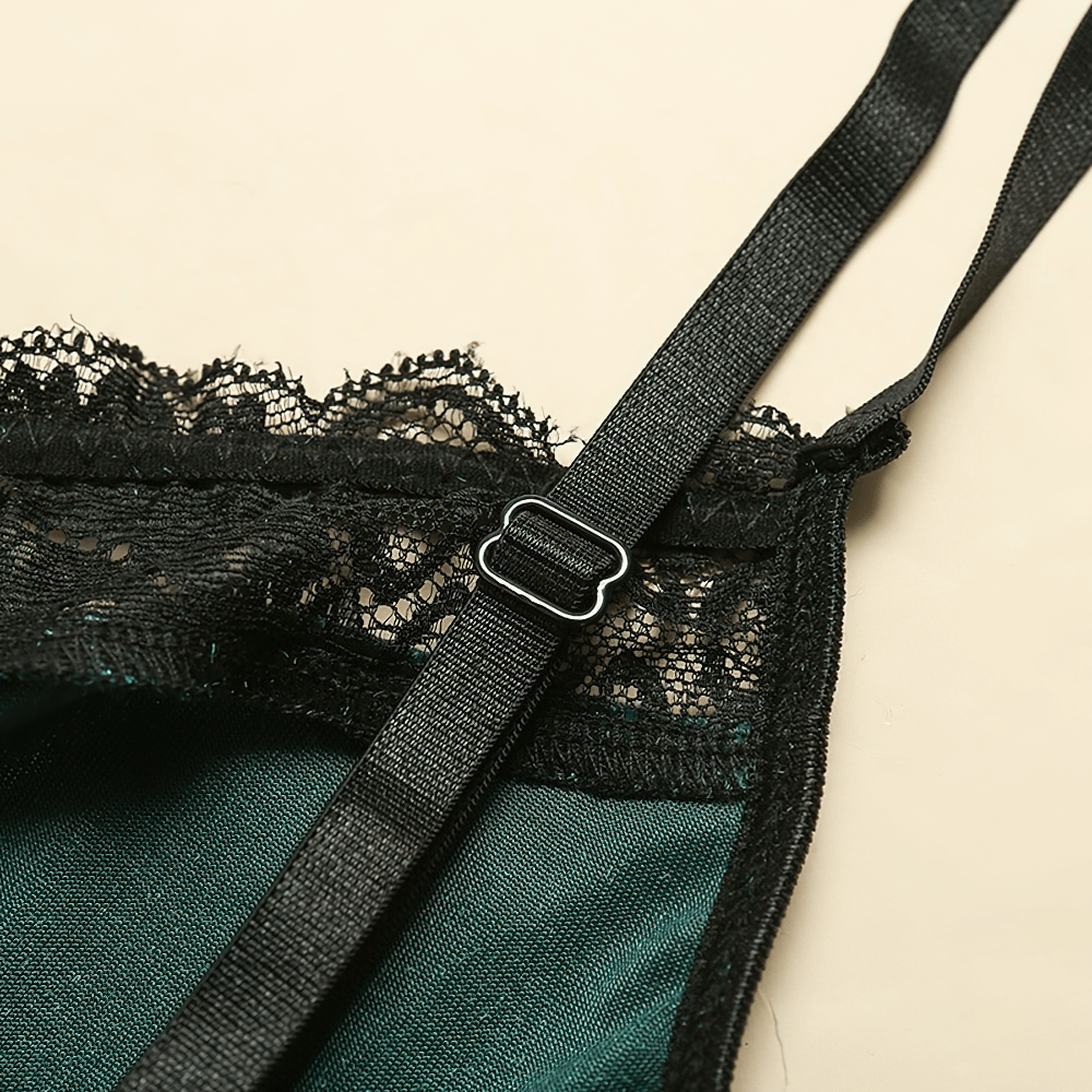 Close-up of black lace trim and adjustable strap on an elegant women's bodysuit in vintage red.