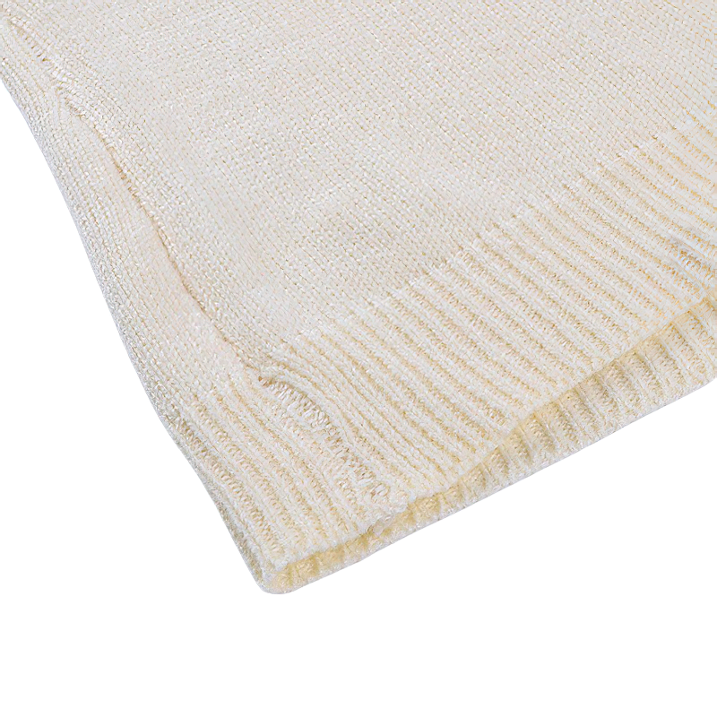 Close-up of women's knitted O-neck short top in cream, showcasing soft texture and stylish ribbed hem.