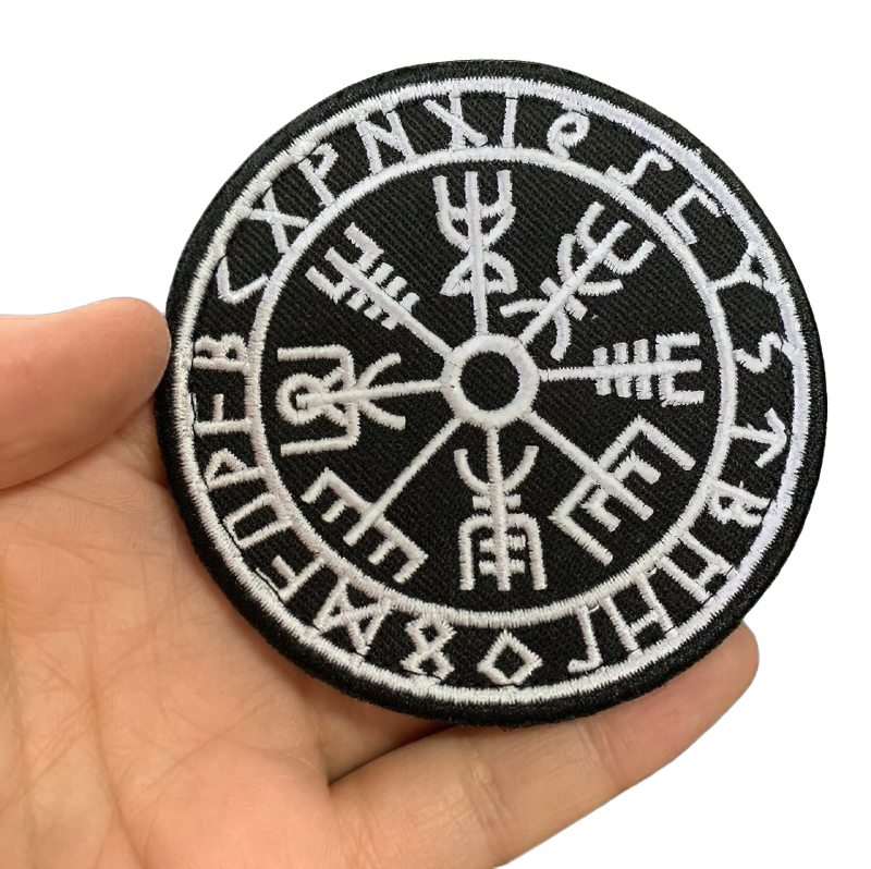 Viking Vegvisir Odin compass iron-on patch held in hand, stylish embroidery for clothing decoration.