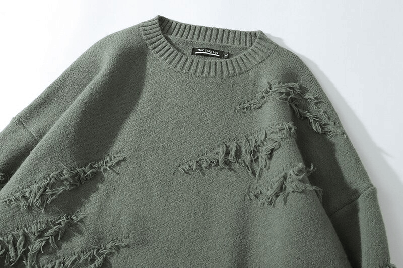 Vintage oversized knitted jumper in green with ripped detail, perfect for stylish men's outfits.