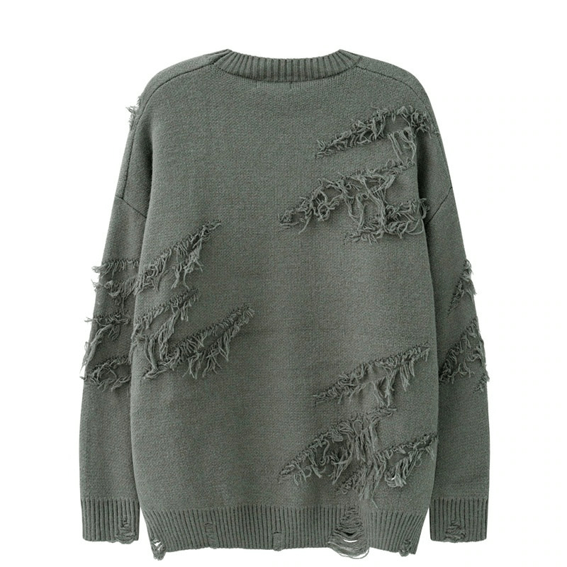 Vintage oversized green knitted sweater with ripped design and distressed details for unique style.