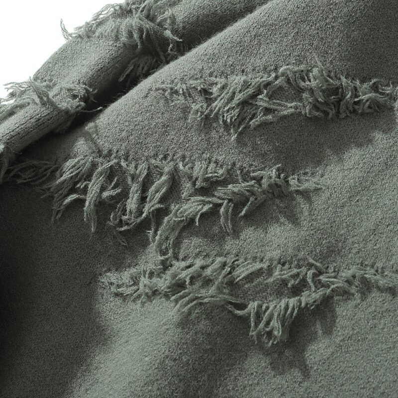 Close-up of vintage acrylic knitted sweater with ripped design, showcasing unique texture and style for oversized men's fashion.