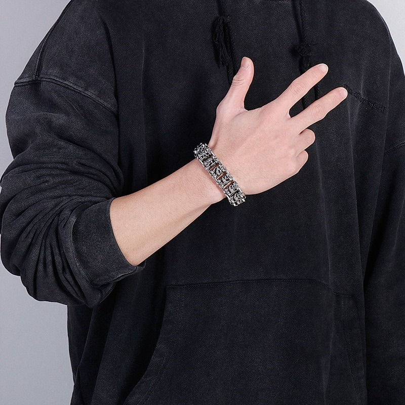 Stylish stainless steel vintage dragon totem bracelet worn by man in black hoodie, showcasing punk jewelry fashion.