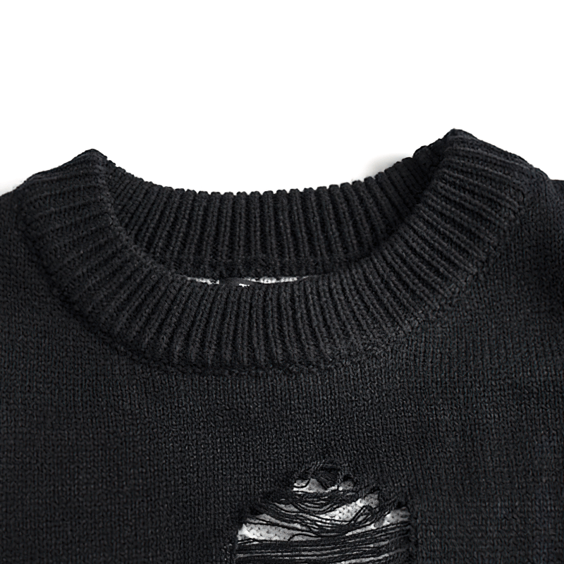 Close-up of a vintage black knitted sweater's casual O-neck with a ripped design, showcasing a stylish oversized look.