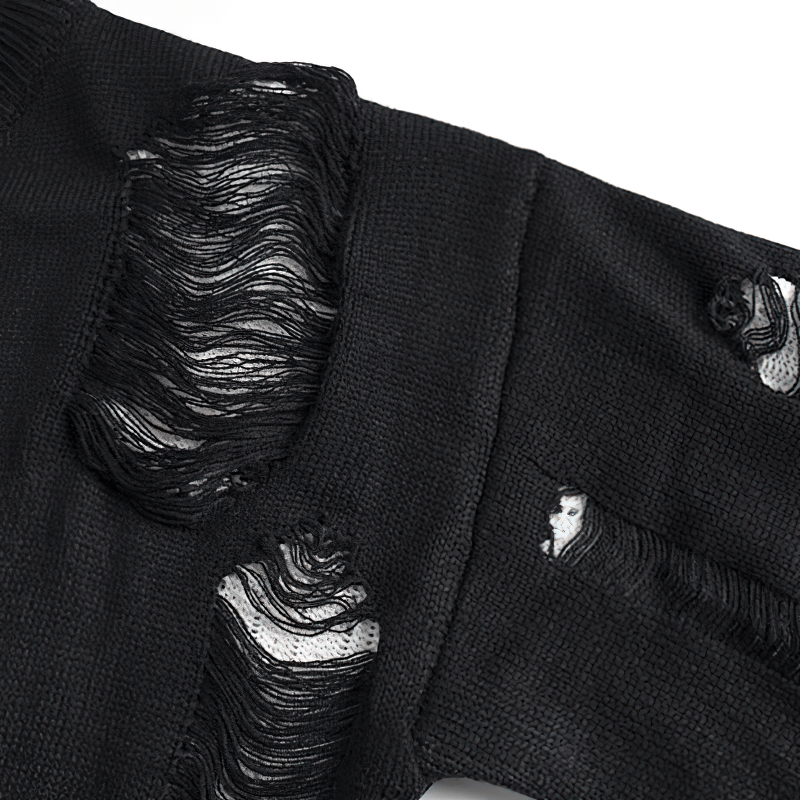 Close-up of a vintage black knitted sweater featuring a ripped design, perfect for casual oversized style.
