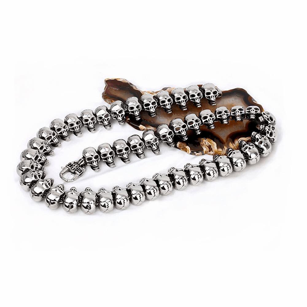 Vintage biker skeleton necklace featuring shiny 316L stainless steel skulls, perfect for rock and punk styles.
