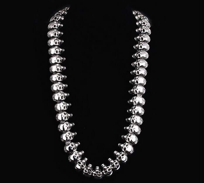 Vintage biker skeleton necklace with skulls, made of stainless steel for rock, goth, or punk styles.