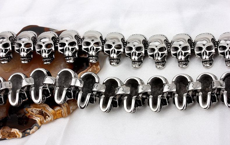 Vintage biker skeleton necklace featuring detailed skull designs in shiny stainless steel, perfect for rock style enthusiasts.