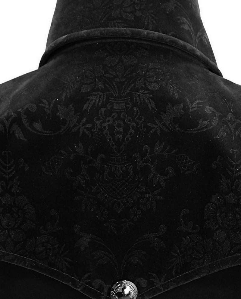 Close-up of vintage black velvet coat's detailed back pattern, showcasing gothic elegance and intricate design.