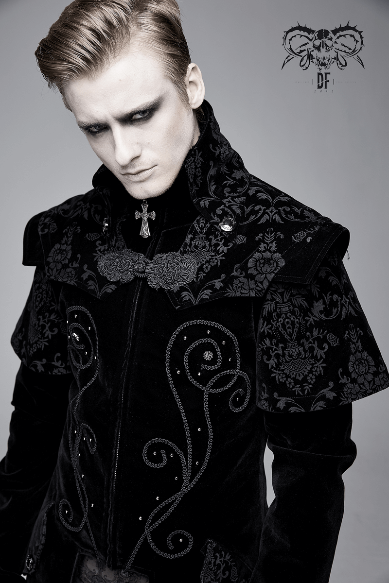 Stylish man in a vintage black velvet gothic coat with intricate floral patterns and a zipper front.