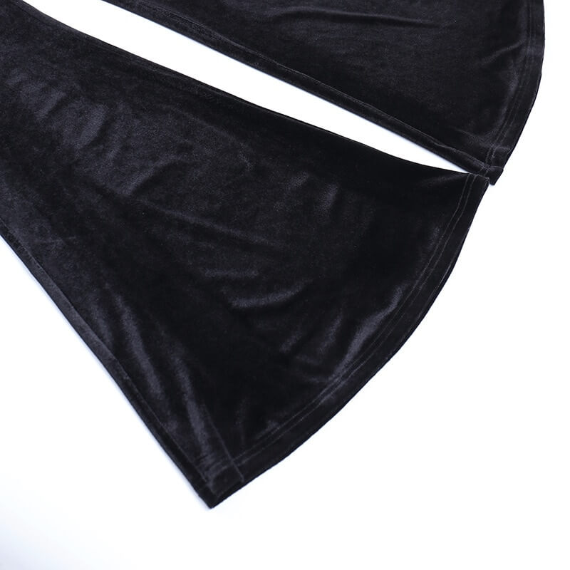 Close-up of luxurious black velvet flare pants showcasing their unique texture and stylish silhouette.