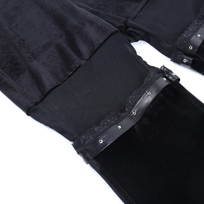 Close-up of black velvet flare pants with mesh inserts showcasing unique gothic style and elegant detailing.