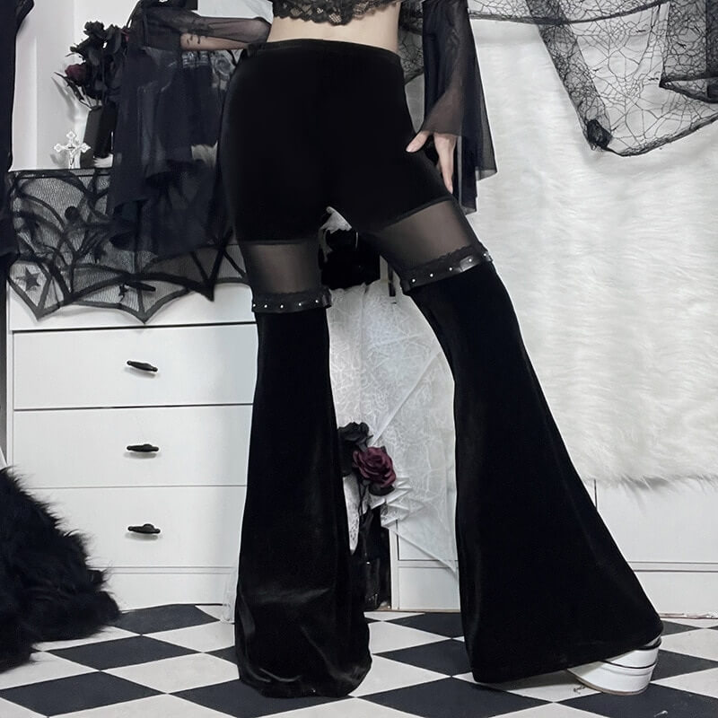 Vintage black velvet flare pants with mesh inserts, showcasing gothic style and unique flair.