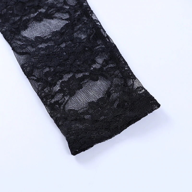 Close-up of vintage black lace fabric for women's goth style long sleeve top, showcasing intricate patterns.