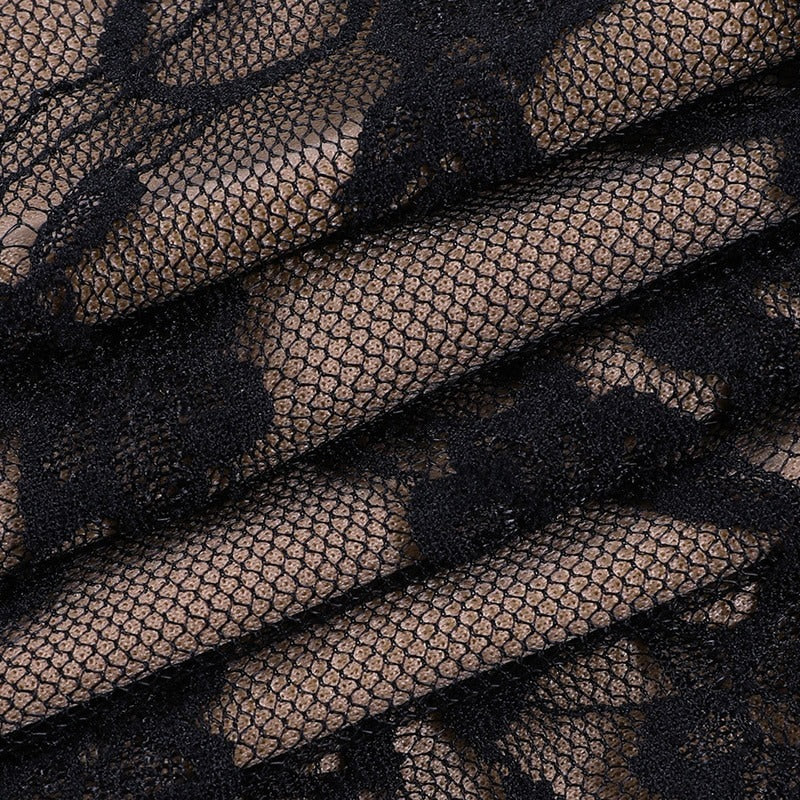 Close-up of vintage black lace fabric, showcasing intricate patterns perfect for gothic-style clothing.