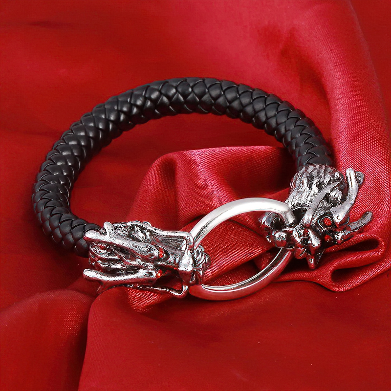 Vintage unisex leather bracelet featuring metal skull and dragon head, perfect for gothic style lovers.