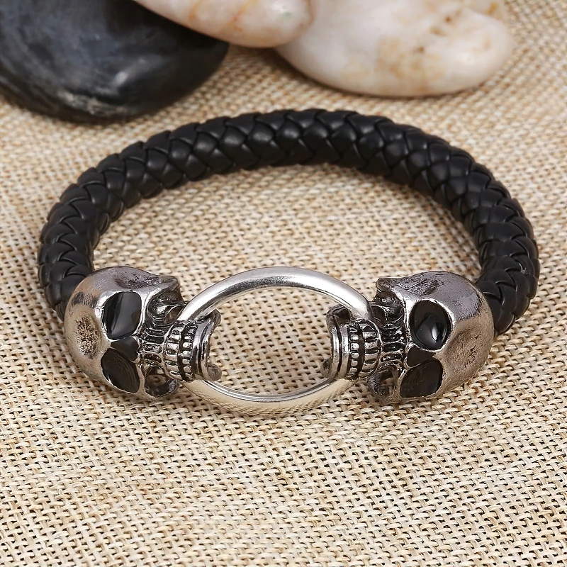 Handmade vintage leather bracelet featuring skull accents and a unique silver lock, perfect for gothic jewelry lovers.