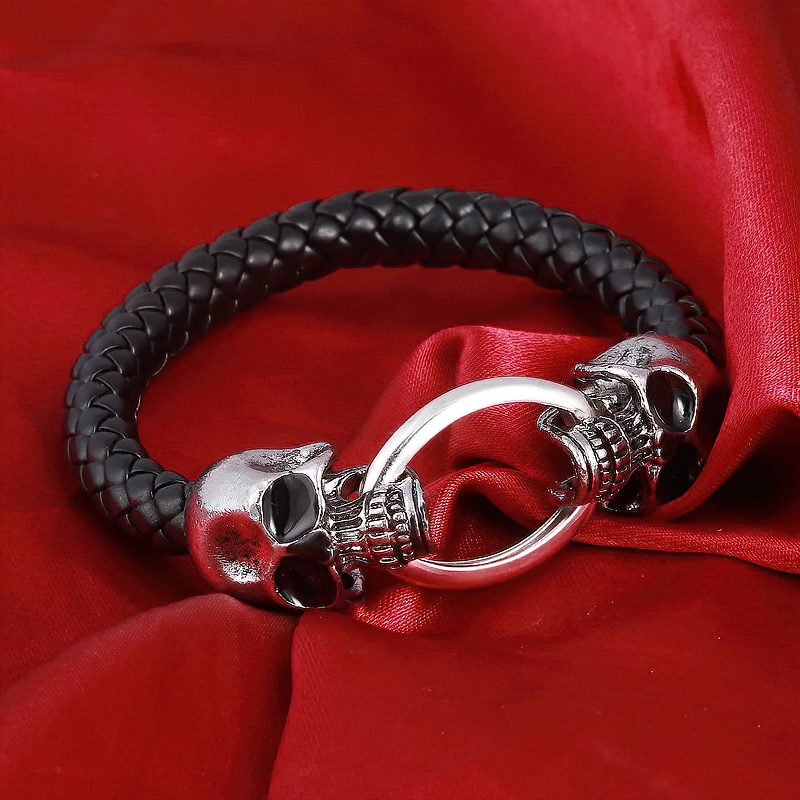 Vintage unisex bracelet featuring metal skull and dragon head, handcrafted leather jewelry for gothic style lovers.