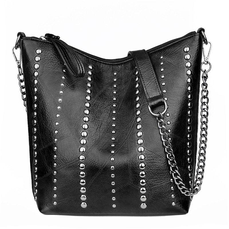 Stylish vintage bucket shape bag for women with rivets and chain strap, perfect for grunge outfits.