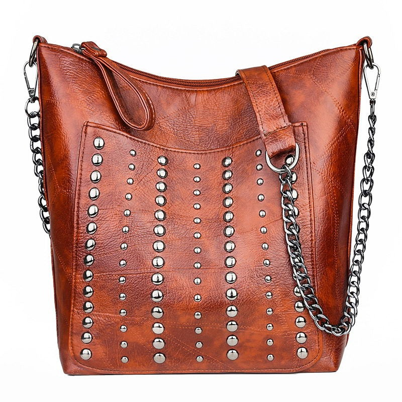 Vintage bucket shape bag for women with rivets, stylish PU leather crossbody handbag in brown.