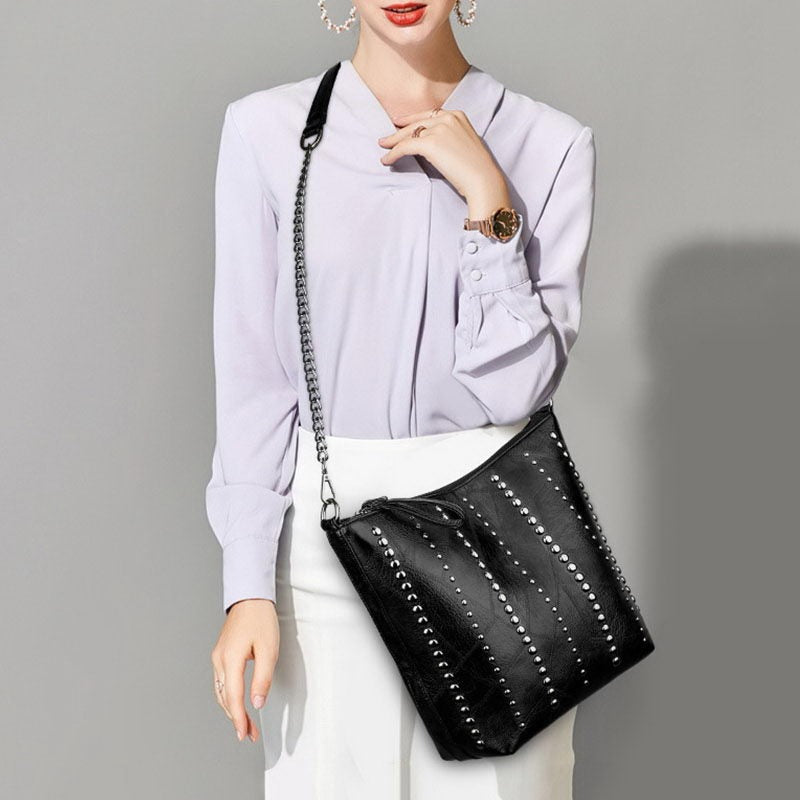 Stylish vintage bucket shape bag with rivets, perfect for women's grunge outfits. Ideal for everyday use.