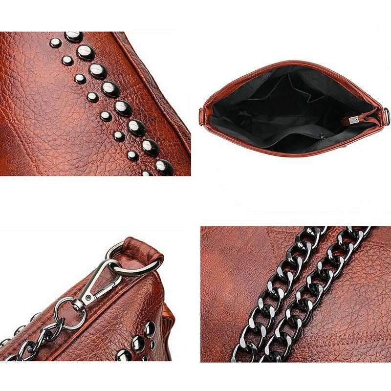 Close-up of vintage bucket shape bag for women featuring rivets and chain detail, showcasing interior and zipper.