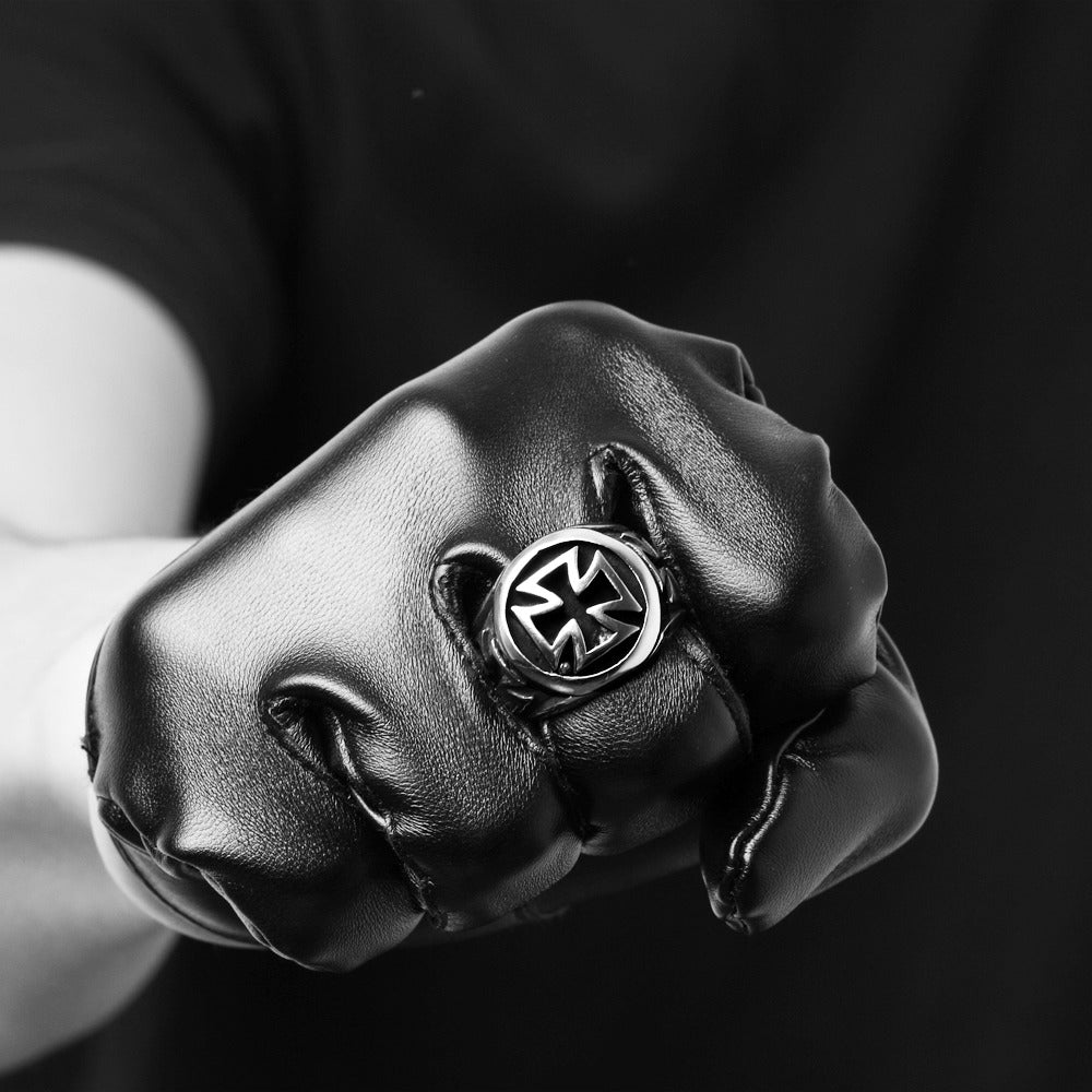 Vintage Celtic Cross ring showcased on a clenched fist, emphasizing biker style and bold fashion.