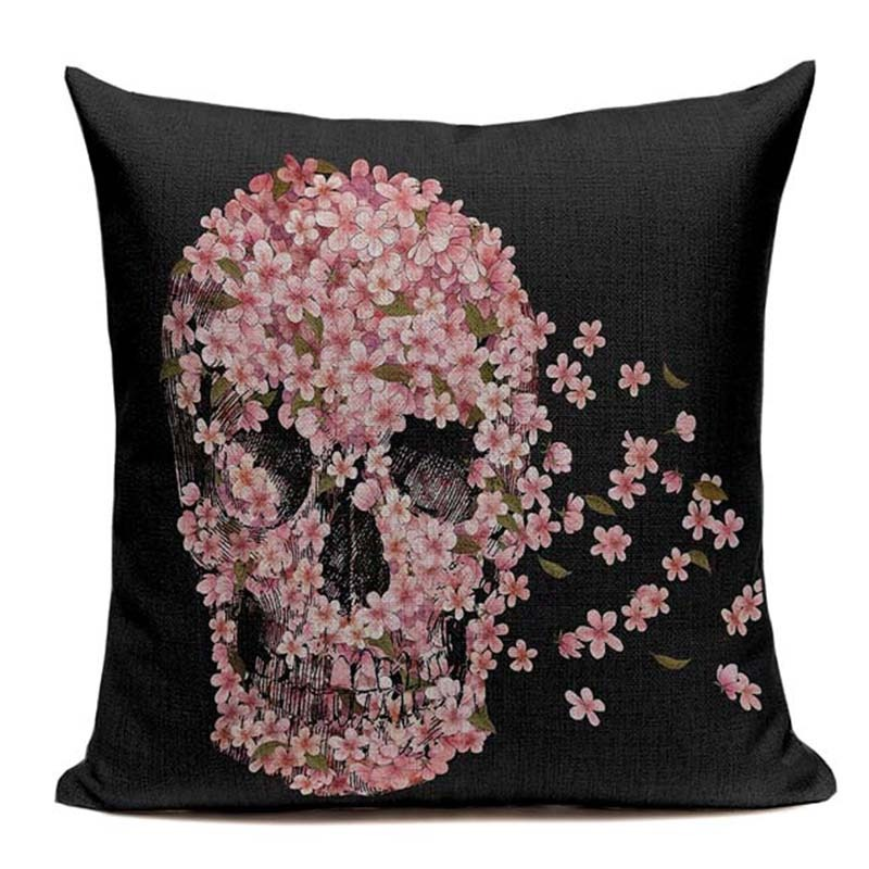 Vintage skull print cushion cover adorned with blooming flowers on a black background, perfect for alternative decor.