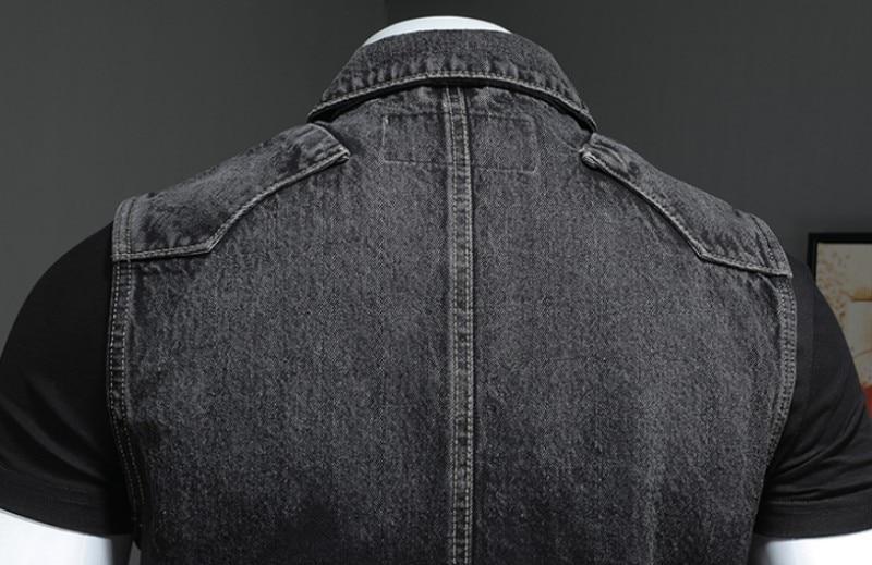 Back view of a vintage sleeveless denim biker vest highlighting its chic stand-up collar and durable fabric.