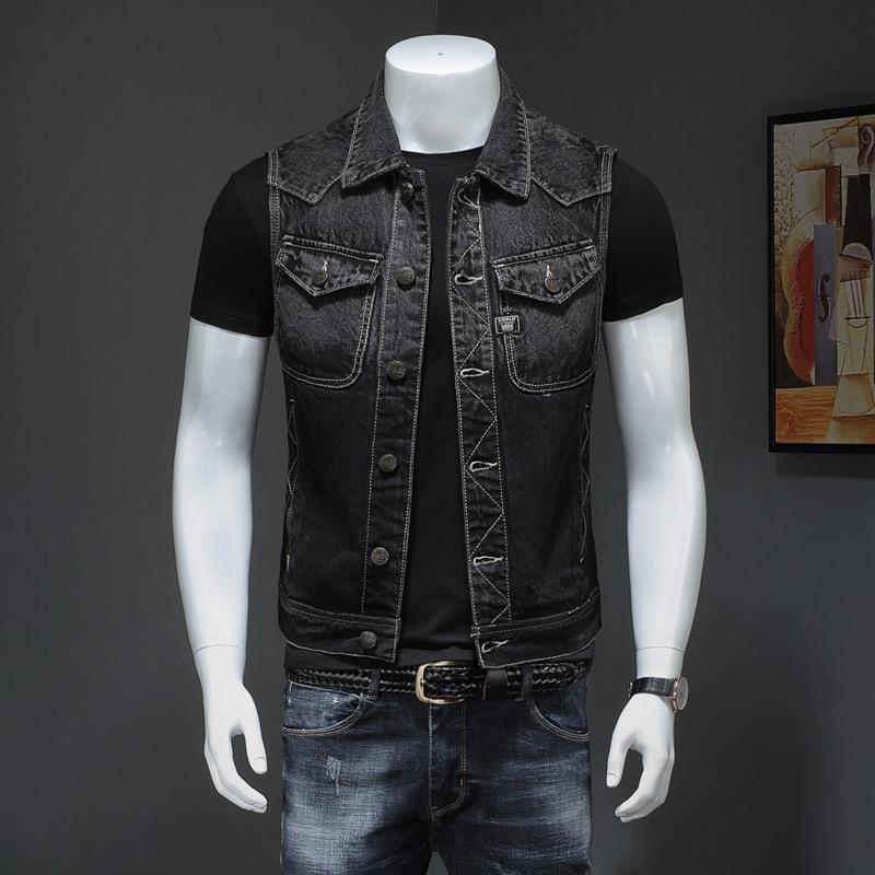 Men's vintage sleeveless denim biker vest in black, perfect for a rock-style outfit with pockets and a stand-up collar.