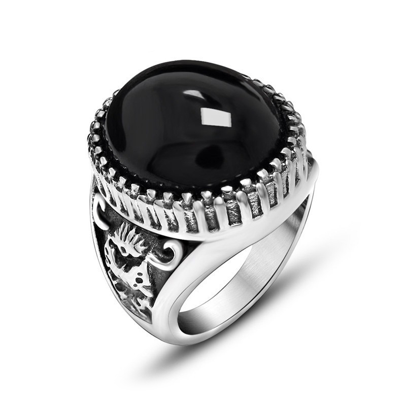 Vintage unisex stainless steel ring featuring a large black stone, perfect for alternative fashion and as a unique gift.