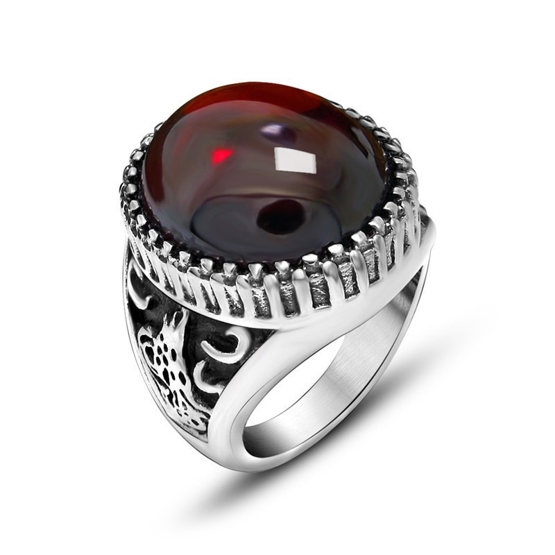 Vintage design unisex ring with large red stone set in stainless steel, perfect for alternative fashion lovers.