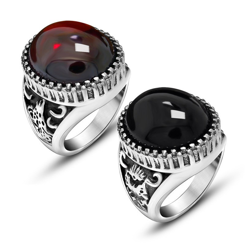 Unisex vintage stainless steel rings featuring large black and red stones, perfect for alternative fashion lovers.