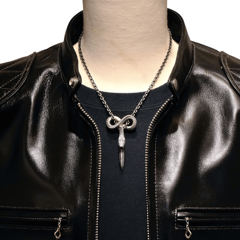 Vintage snake pendant necklace on a mannequin, showcasing punk style fashion with a sleek leather jacket.