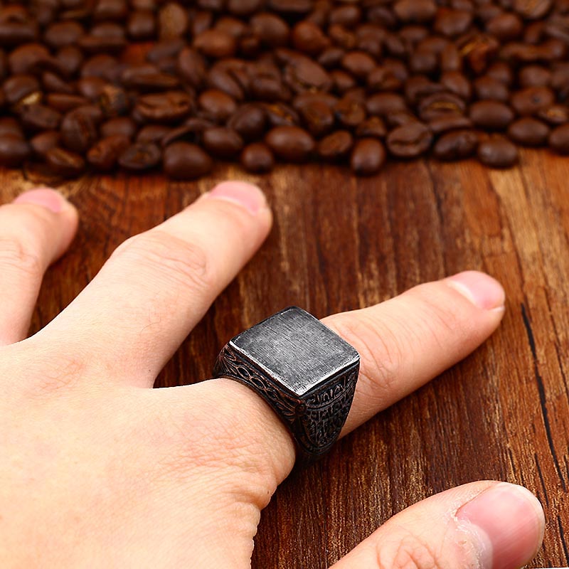 Vintage square design stainless steel ring showcased on a hand with coffee beans in the background, perfect for unisex fashion.