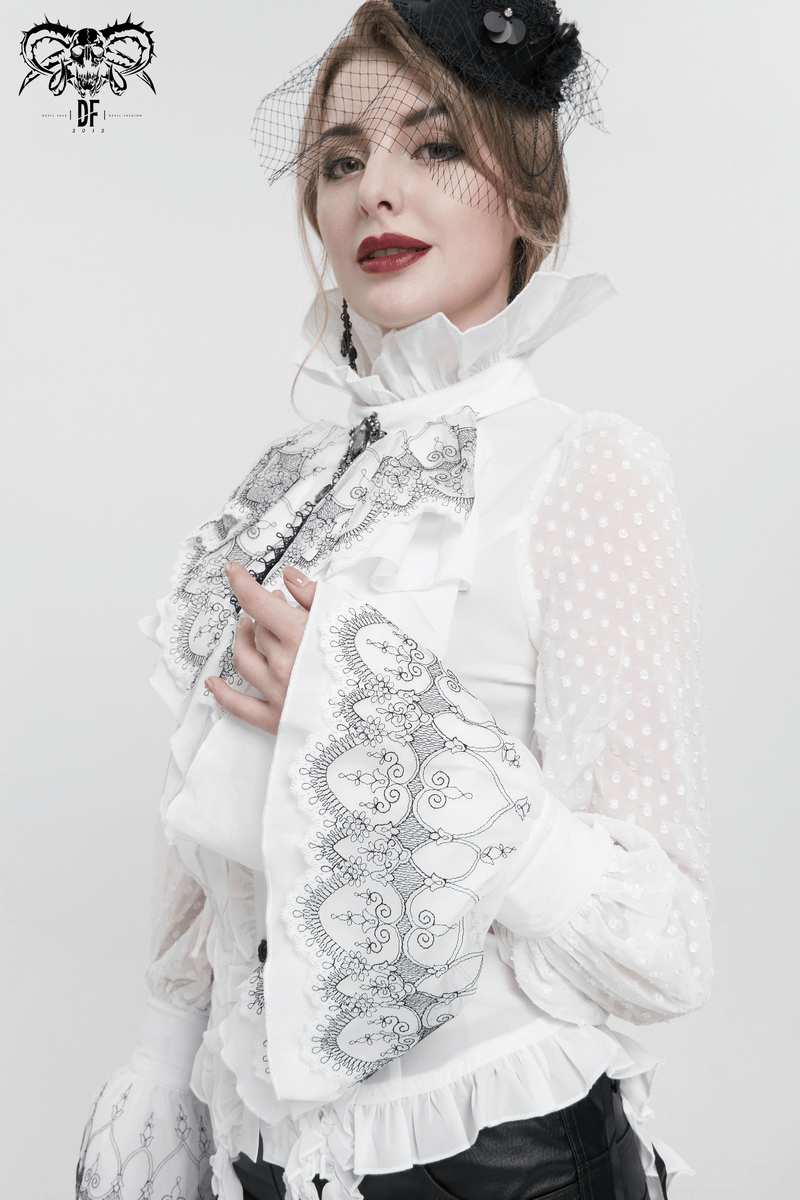 Fashionable model in white gothic blouse with lace details and statement sleeves, showcasing a unique and stylish look.