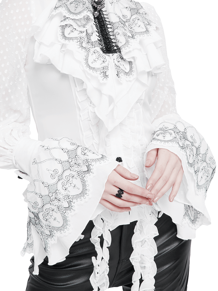 Gothic women's white blouse with ruffled lace trim and bell sleeves, styled with black accessories.