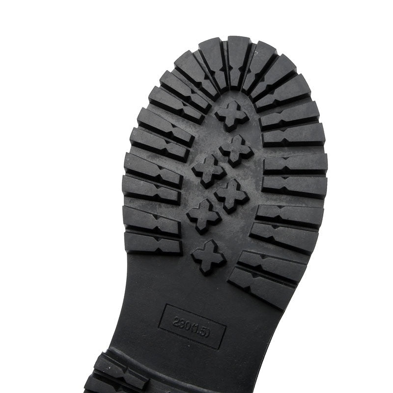 Sleek rubber sole of vintage genuine leather ankle boots showcasing traction design for comfort and style.