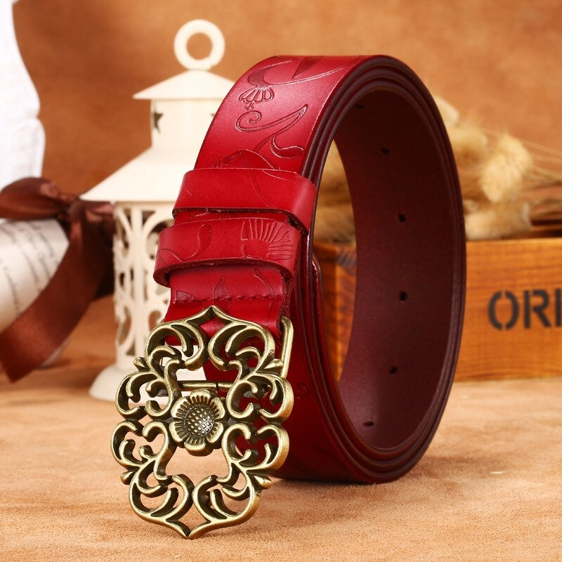 Vintage red genuine leather belt with geometric pattern buckle, perfect for gothic and alternative fashion outfits.