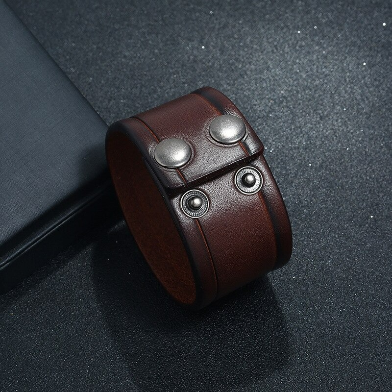 Vintage genuine leather wide bracelet for men and women, featuring silver studs, perfect punk-rock accessory.