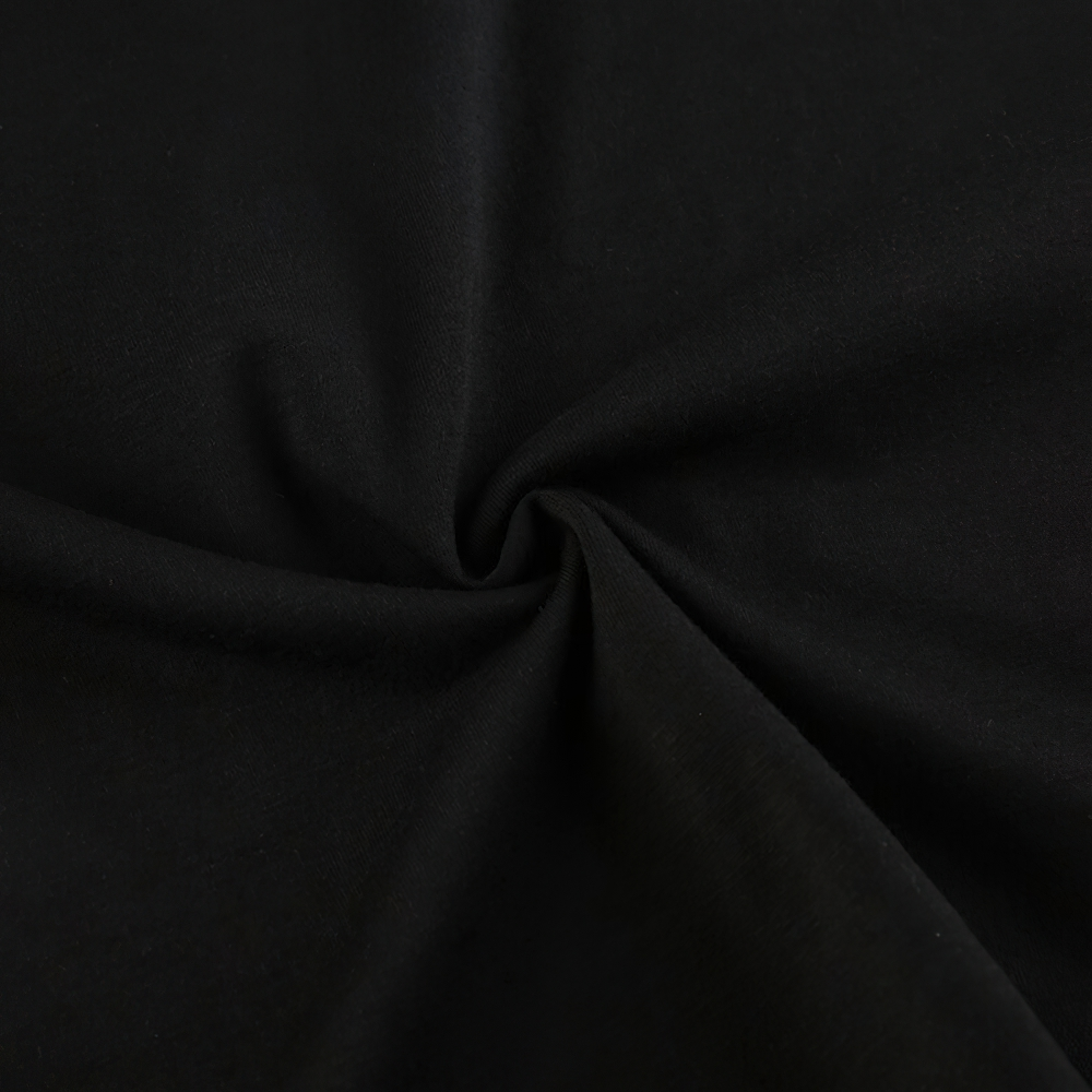 Close-up view of soft black fabric texture perfect for vintage grunge style clothing.