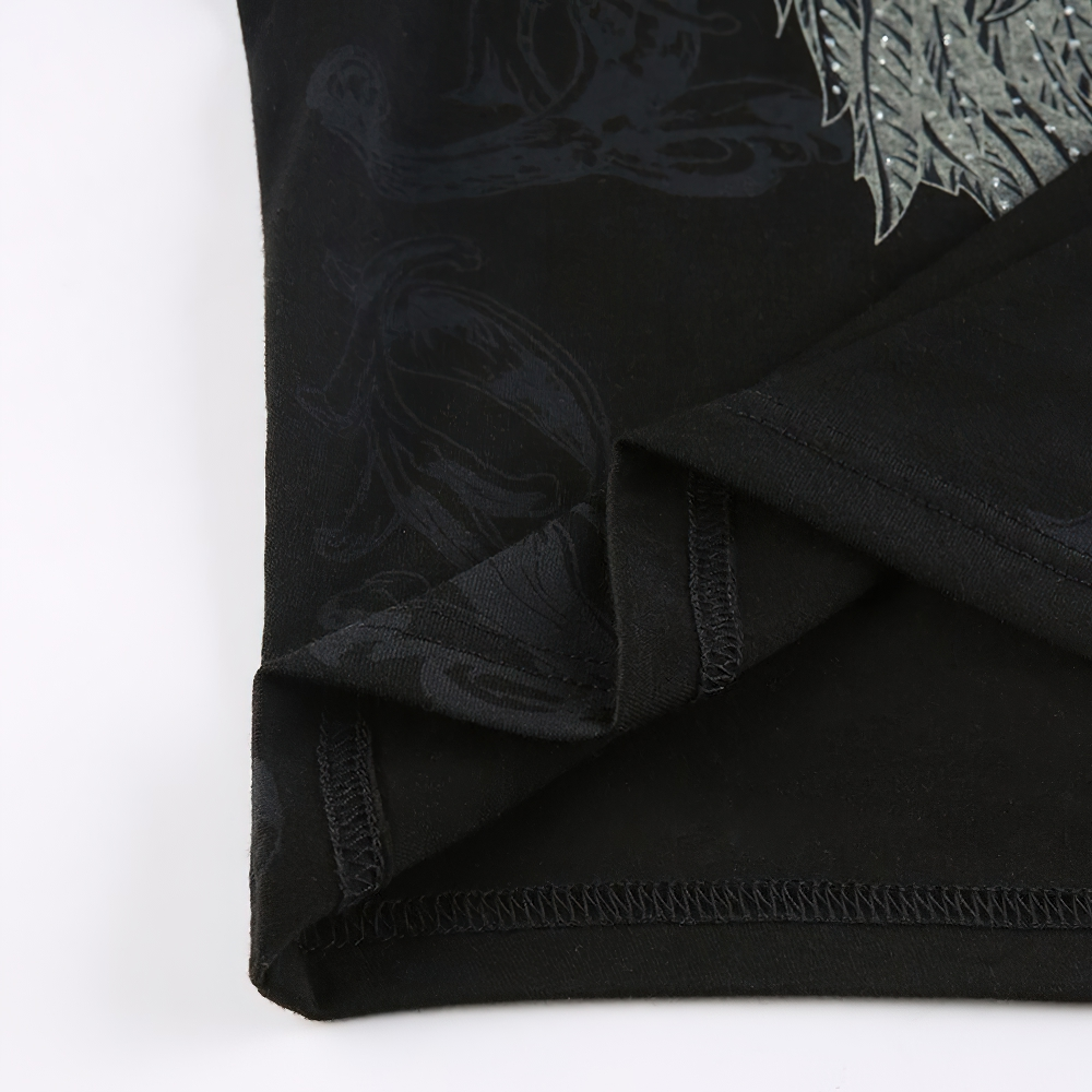 Close-up of black vintage grunge crop top showcasing detailed print and stylish hemline.