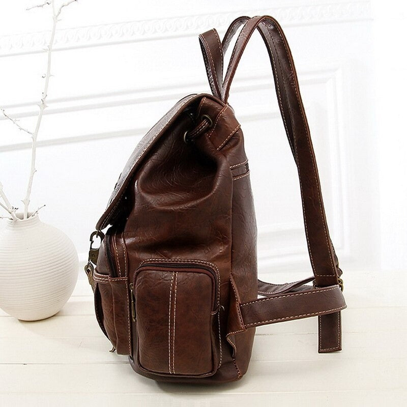Vintage brown PU leather women's backpack with stylish pockets for alternative fashion and grunge outfits.