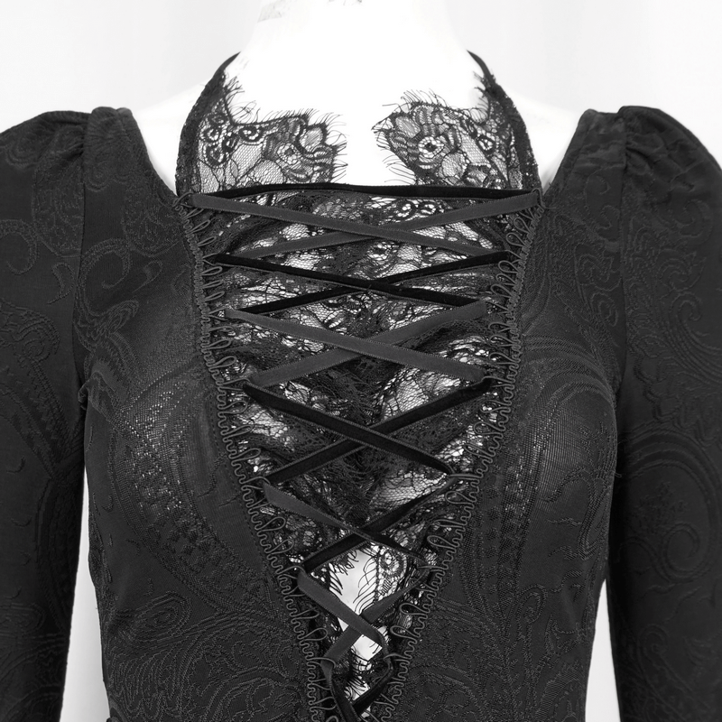 Vintage black top with flared lace sleeves and seductive lace-up front detail.