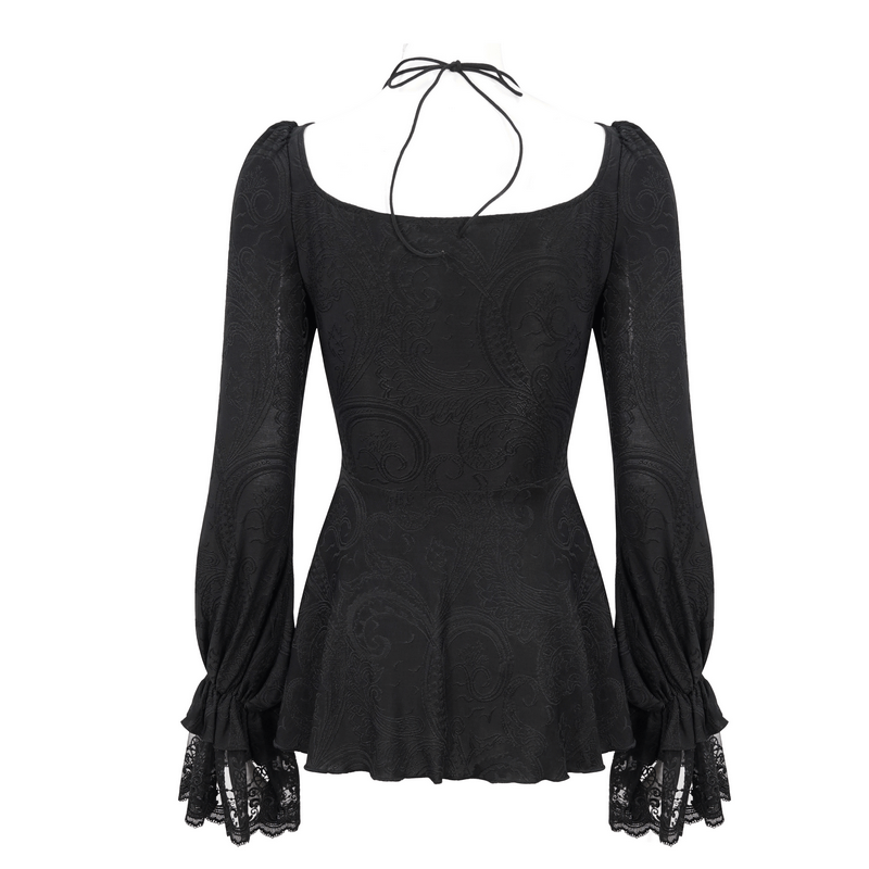 Back view of vintage irregular black top with flared lace sleeves and lace-up neckline.