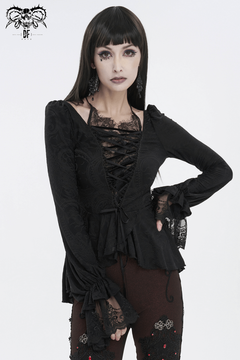 Vintage black top with flared lace sleeves and lace-up front, showcasing seductive style and modern allure.