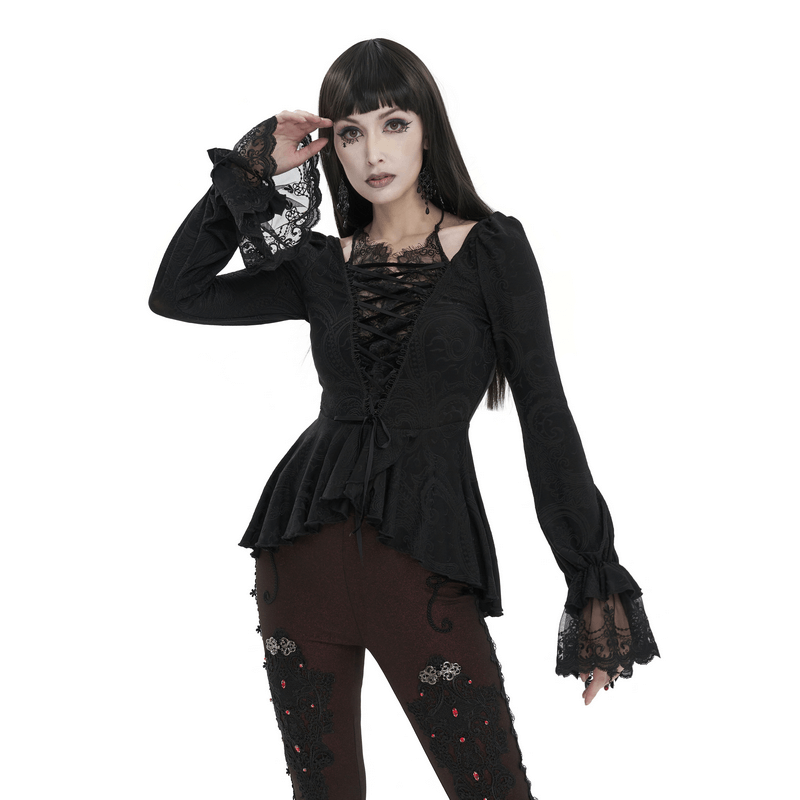 Vintage irregular black top with flared lace sleeves and lace-up front, perfect for a sexy and daring outfit.