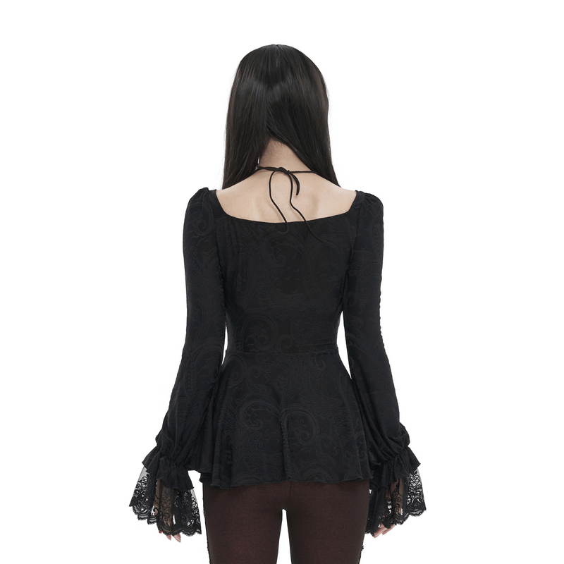 Back view of a vintage black top with flared lace sleeves and lace-up detail, perfect for a sexy, modern look.